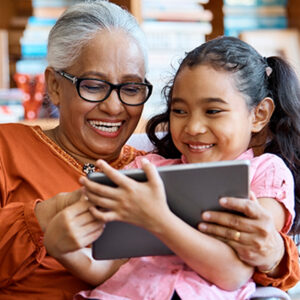 grandma reading to grandaughter